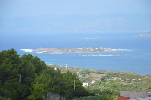 a view of the ocean and an island at Guardia dei Mori in Carloforte