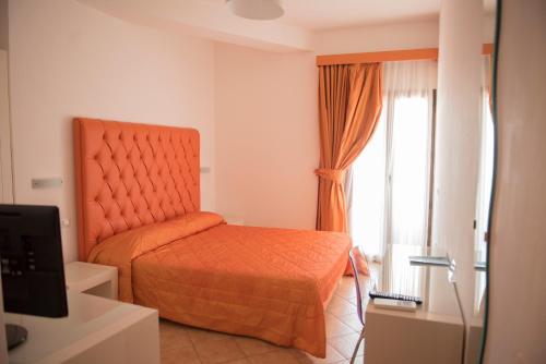 Postel nebo postele na pokoji v ubytování Hotel Caluna Charme