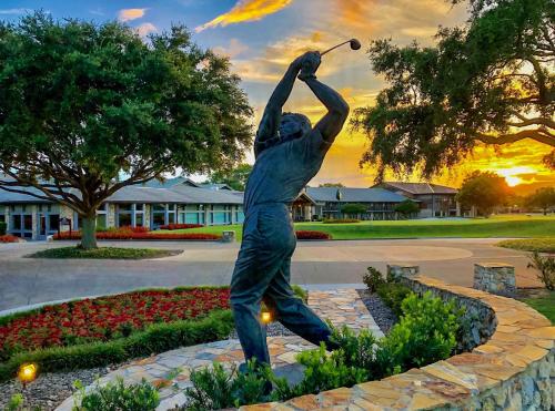 a statue of a man swinging a golf club at Arnold Palmer's Bay Hill Club & Lodge in Orlando