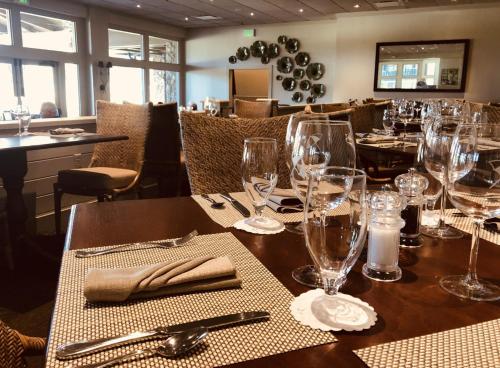 a table in a restaurant with wine glasses on it at Arnold Palmer's Bay Hill Club & Lodge in Orlando
