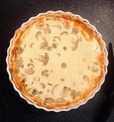 a pie in a pie dish on a table at WINNIE'S BED & BREAKFAST in Lawrenceburg