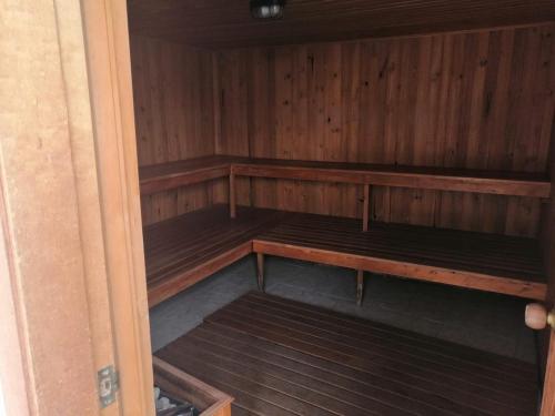 an empty sauna with wooden shelves in a room at Terrazas de San Agustin Hotel in San Agustín