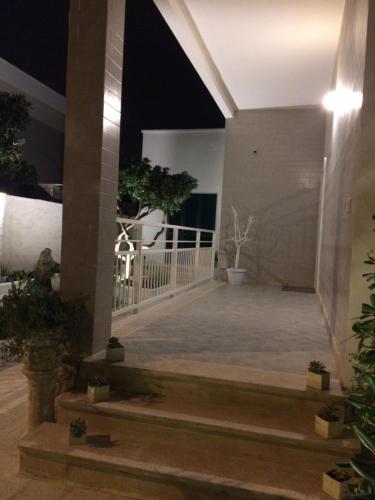 a view of the front porch of a house at night at B&B Villa S.Anna in Bari