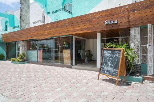 a large brick building with a large window at Selina Cancun Downtown in Cancún
