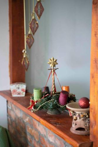 a table with christmas decorations on top of it at Apartments Holiday Home Srce in Kopaonik