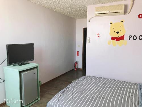 TV a/nebo společenská místnost v ubytování Sheng Feng Homestay
