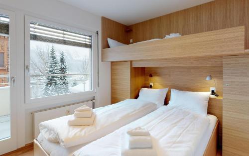 Un pat sau paturi într-o cameră la Au Réduit U06