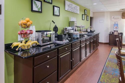 a kitchen with a counter with fruit on it at Sleep Inn Peachtree City - Atlanta in Peachtree City