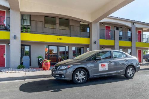 a silver car parked in front of a building at Econo Lodge West - Coors Blvd in Albuquerque