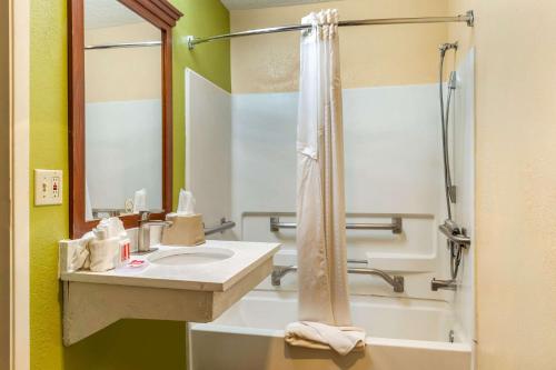 a bathroom with a sink and a shower at Econo Lodge West - Coors Blvd in Albuquerque