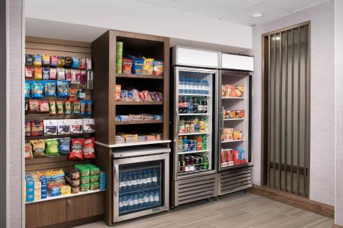 a pantry with two large refrigerators and food at Holiday Inn Express & Suites Baltimore - BWI Airport North by IHG in Linthicum Heights