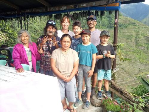 a group of people posing for a picture at BATAD Rita's Mount View Inn and Restaurant in Banaue