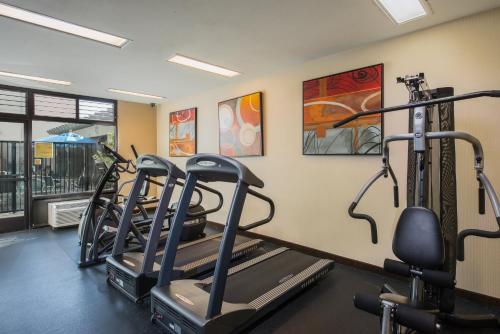 a gym with two treadmills and two exercise bikes at Holiday Inn Express & Suites Santa Clara - Silicon Valley by IHG in Santa Clara