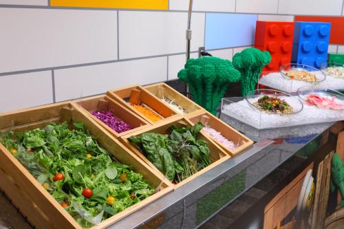 a counter with three crates of vegetables on it at LEGOLAND Japan Hotel in Nagoya