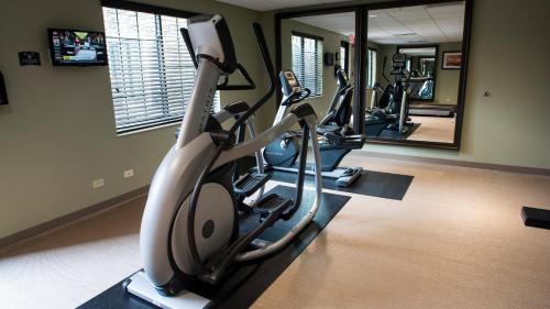 a row of exercise bikes in a gym with mirrors at Staybridge Suites Lexington by IHG in Lexington