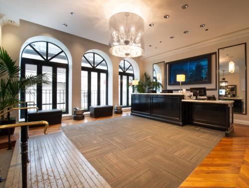 a large living room with a chandelier at Holiday Inn Express Chicago - Magnificent Mile by IHG in Chicago