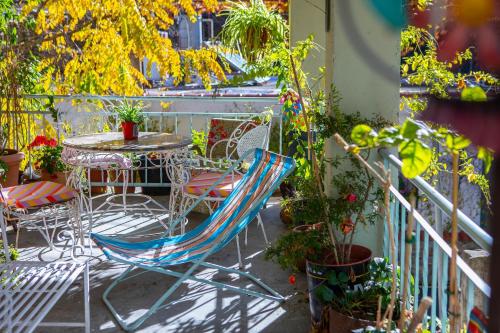 a patio with a table and chairs and potted plants at Tina's Country Home in Askas