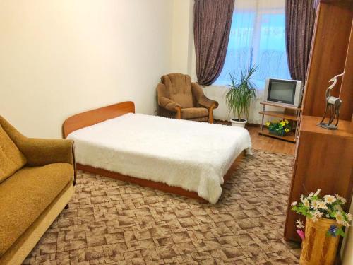 Łóżko lub łóżka w pokoju w obiekcie Двухкомнатная квартира на Черниговской 4