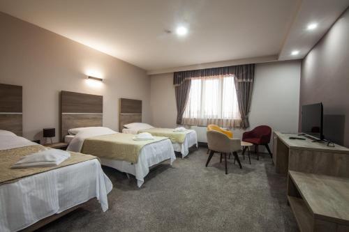 Ένα ή περισσότερα κρεβάτια σε δωμάτιο στο Hotel Intergaj Bijeljina