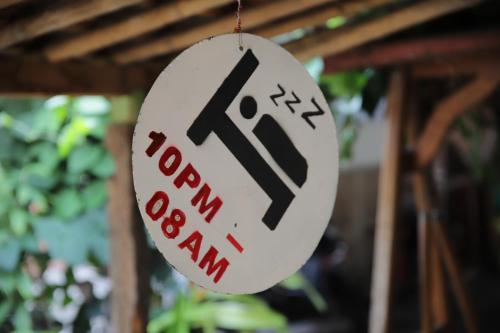 a sign that says roon hanging from a ceiling at Arjuna Garden Homestay in Yogyakarta