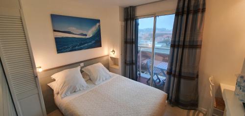 Postel nebo postele na pokoji v ubytování Hotel Cote d'Argent