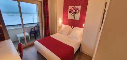 Ένα ή περισσότερα κρεβάτια σε δωμάτιο στο Hotel Cote d'Argent