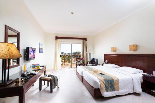 Ένα ή περισσότερα κρεβάτια σε δωμάτιο στο Three Corners Sunny Beach Resort