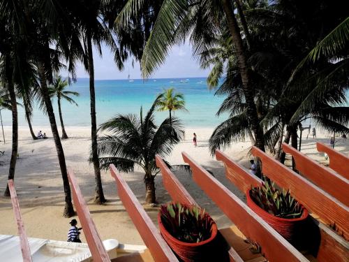a view of the beach from the balcony of a resort at Boracay Mandarin Island Hotel in Boracay