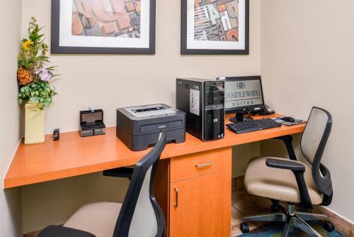 an office with a desk with a computer and a printer at Candlewood Suites Abilene by IHG in Abilene