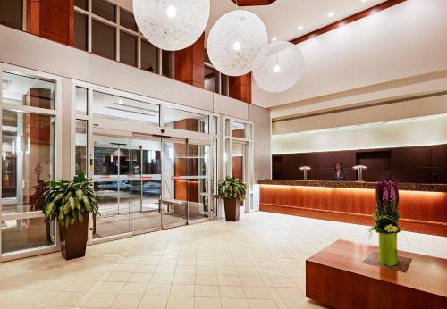 a lobby of a hotel with potted plants at InterContinental Suites Hotel Cleveland by IHG in Cleveland