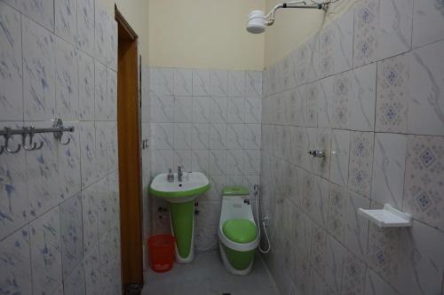 a bathroom with a sink and a toilet at Bahir Dar Backpackers in Bahir Dar