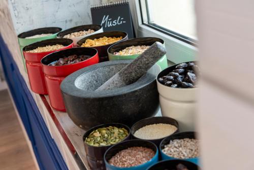 a group of containers of different types of food at ibis Styles Dresden Neustadt in Dresden