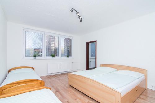 Postel nebo postele na pokoji v ubytování Apartmán Slezská