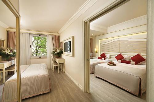Ένα ή περισσότερα κρεβάτια σε δωμάτιο στο Halifaks Hotel