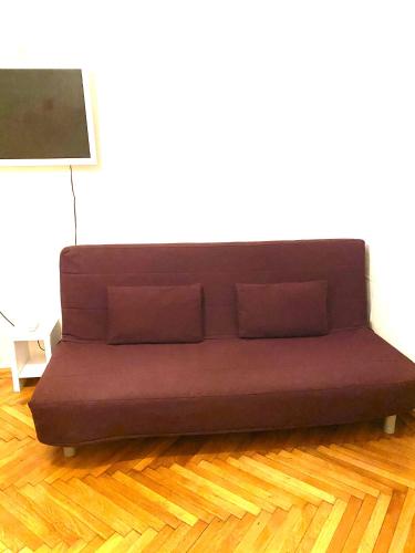 a brown couch in a room with a lamp at Apartment opera 1 in Vienna