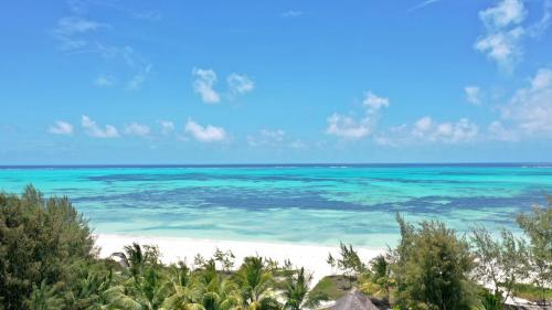 a view of the ocean from a beach at Amani Boutique Hotel - Small Luxury Hotels of the World in Paje