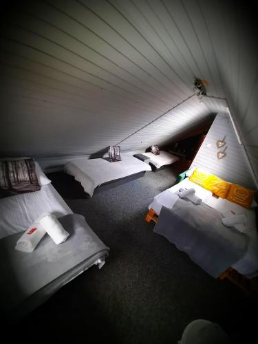 a group of four beds in a tent at Dworek Zakopane in Zakopane