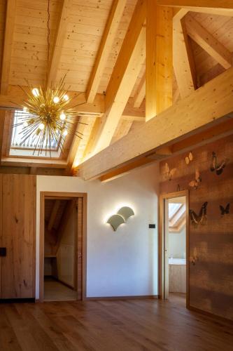 a room with wooden ceilings and a vaulted ceiling at Asiago Sporting Hotel & Spa in Asiago