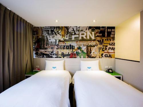 Ένα ή περισσότερα κρεβάτια σε δωμάτιο στο Wholesome Hotel