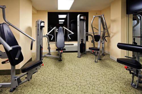 a gym with cardio equipment in a hotel room at Holiday Inn & Suites Clearwater Beach by IHG in Clearwater Beach
