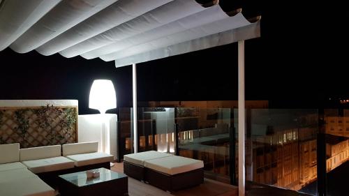 a living room with a couch and a table at Hotel Mendez Nuñez in Lugo