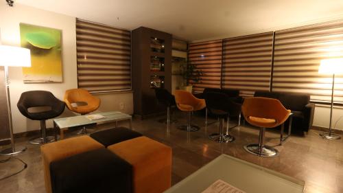 a waiting room with chairs and a couch and a table at SİVAS HOTEL NEVV in Sivas