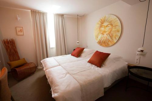 Ein Bett oder Betten in einem Zimmer der Unterkunft B-Lodge Boutique Hôtel