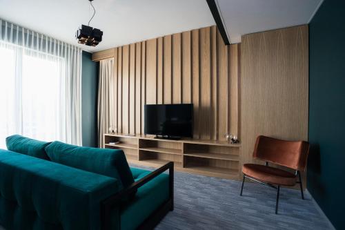 Una televisión o centro de entretenimiento en Wasa Resort Hotel, Apartments & SPA