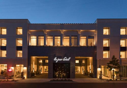a building with a sign on the front of it at Kimpton La Peer Hotel West Hollywood by IHG in Los Angeles
