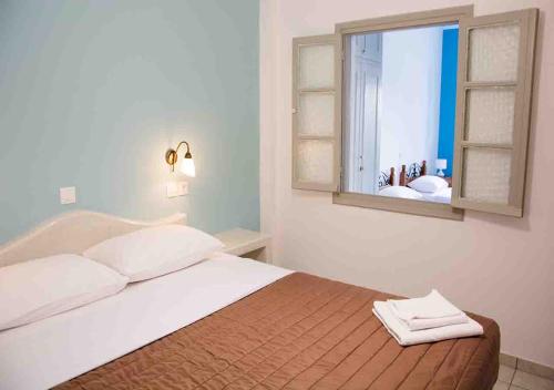 Sail Inn Studios & Apartmentsにあるベッド