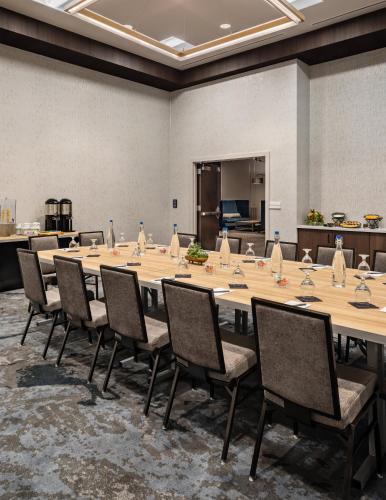 a large conference room with a long table and chairs at Crowne Plaza North Augusta, by IHG in North Augusta