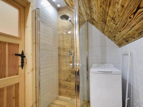a bathroom with a shower and a toilet in it at Przedsionek Tatr in Zakopane