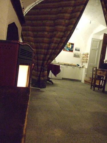 a living room with a fireplace in a house at La stufa rossa in Sondrio