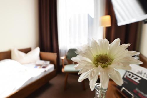 Gasthof & Hotel Goldener Hirschにあるベッド